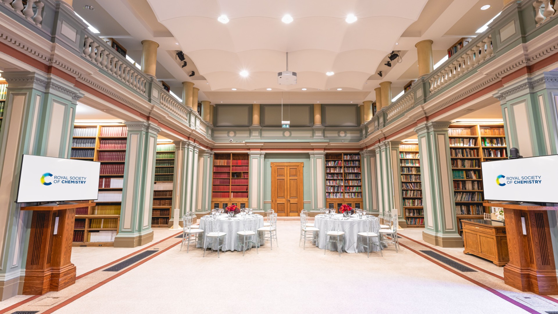Library with two white tables and screens Library with two white tables and screens