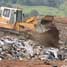 Tractor on landfill