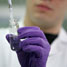Scientist pipetting a liquid