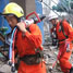Fire fighters at the scene of the Guangxi Vinylon Group plant blast