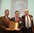 RSC President Dr Simon Campbell is pictured presenting a Historic Chemical Landmark plaque at the University of Cambridge Department of Chemistry