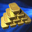 Blue light shining on gold bars