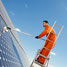 Man cleaning solar panels