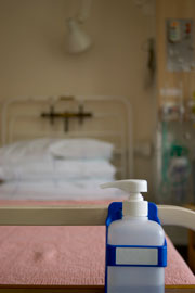 Plastic bottle on table near hospital bed