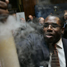 Higher Education minister David Lammy holding a fuming test tube