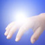 Light shining above a hand