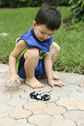 boy with toy car