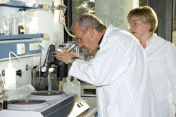 Scientists using a microscope