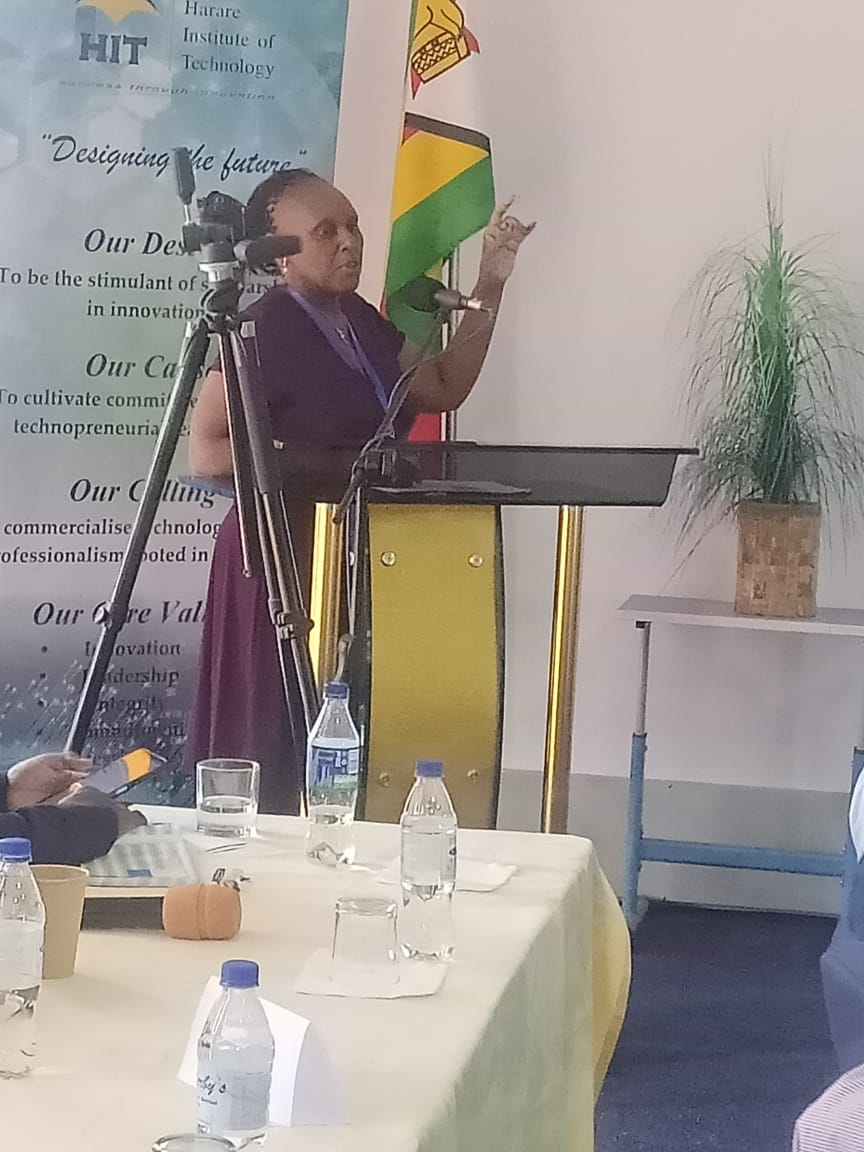 napreca-conference-in-zimbabwe---presenter-in-front-of-stand napreca-conference-in-zimbabwe---presenter-in-front-of-stand