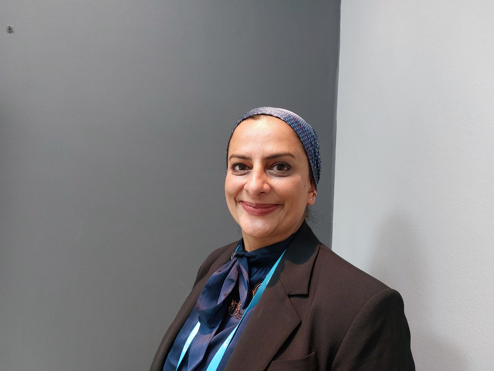 A portrait of Dr Rehana Sidat of GSK in front of a grey background A portrait of Dr Rehana Sidat of GSK in front of a grey background