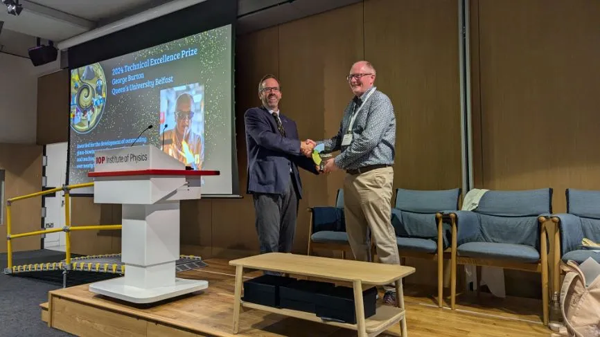 George Burton from Queen's University Belfast (right) shakes hands with RSC Head of Professional Standards Toby Underwood