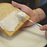 Spreading margarine on toast