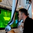 A scientist operating remote arms at Harwell, a nuclear research facility